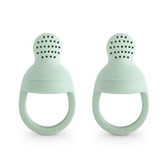 Mushie silicone baby feeder close-up shows soft material for safe, gentle feeding.