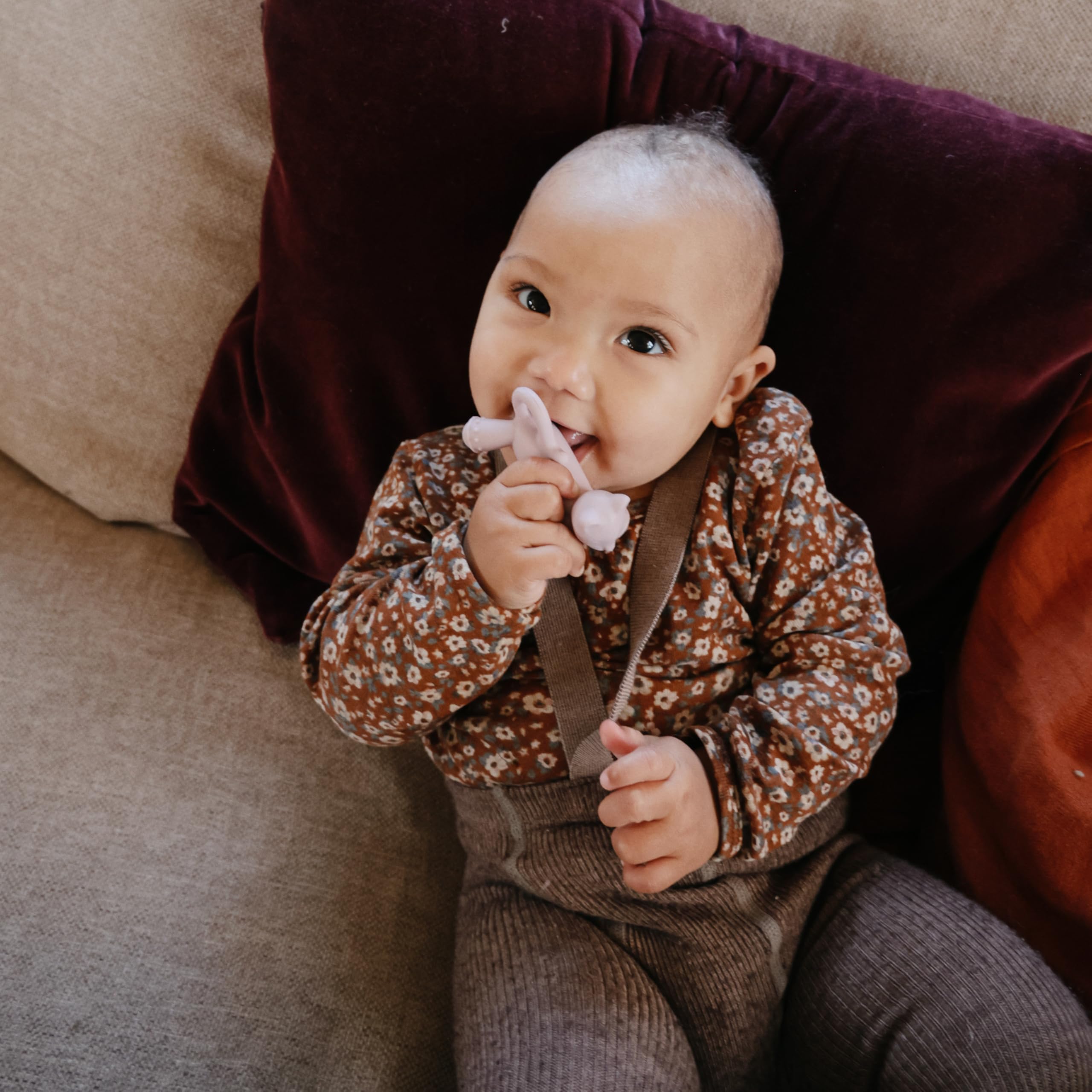 Mushie cat teether demonstrating safe material and gentle texture