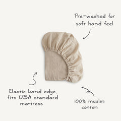 Mushie 52x28 crib sheet with deep pockets ensures snug fit.