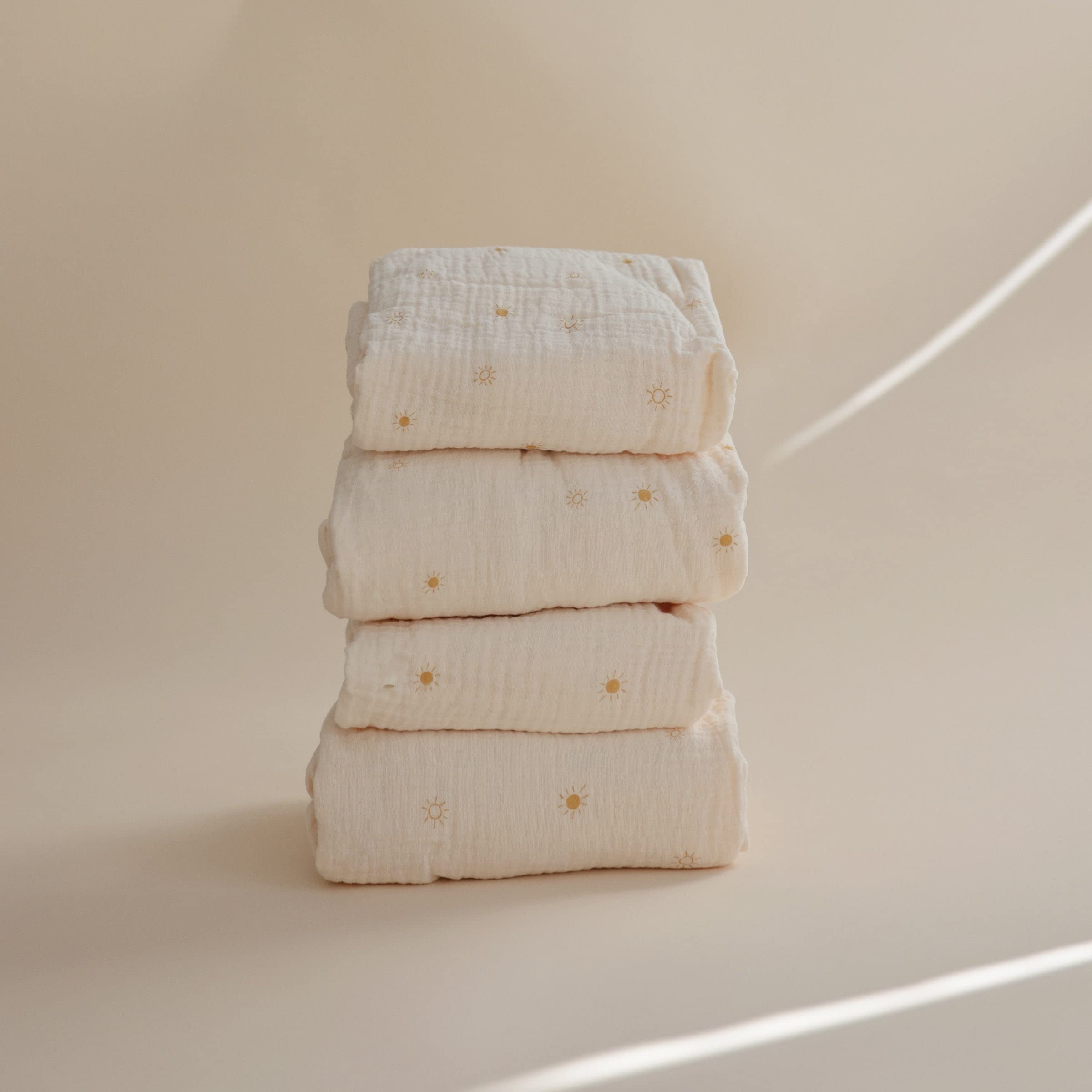 Mushie crib sheet 52x28 sun fit emphasizes secure deep pockets and mattress coverage.