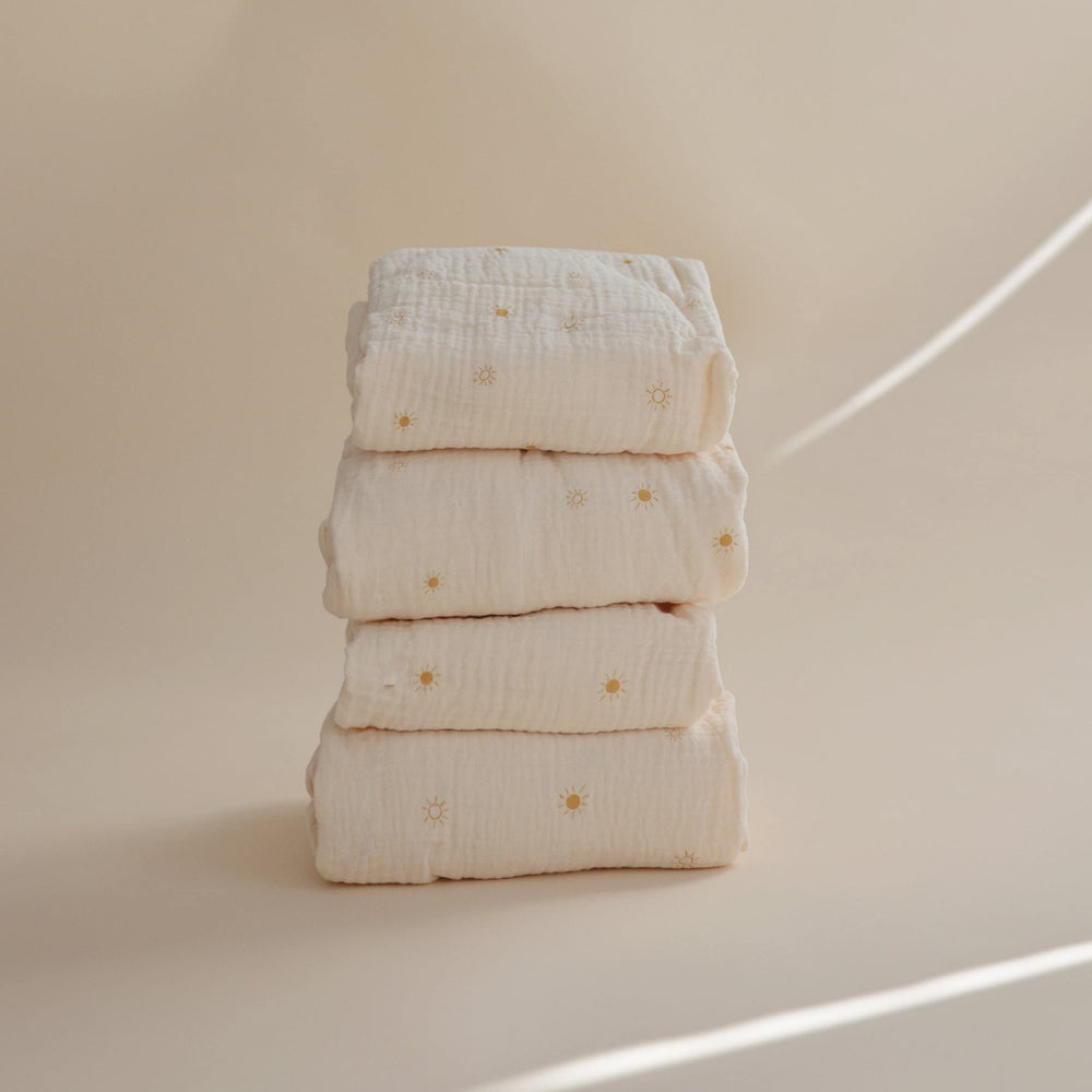 Mushie crib sheet 52x28 sun fit emphasizes secure deep pockets and mattress coverage.