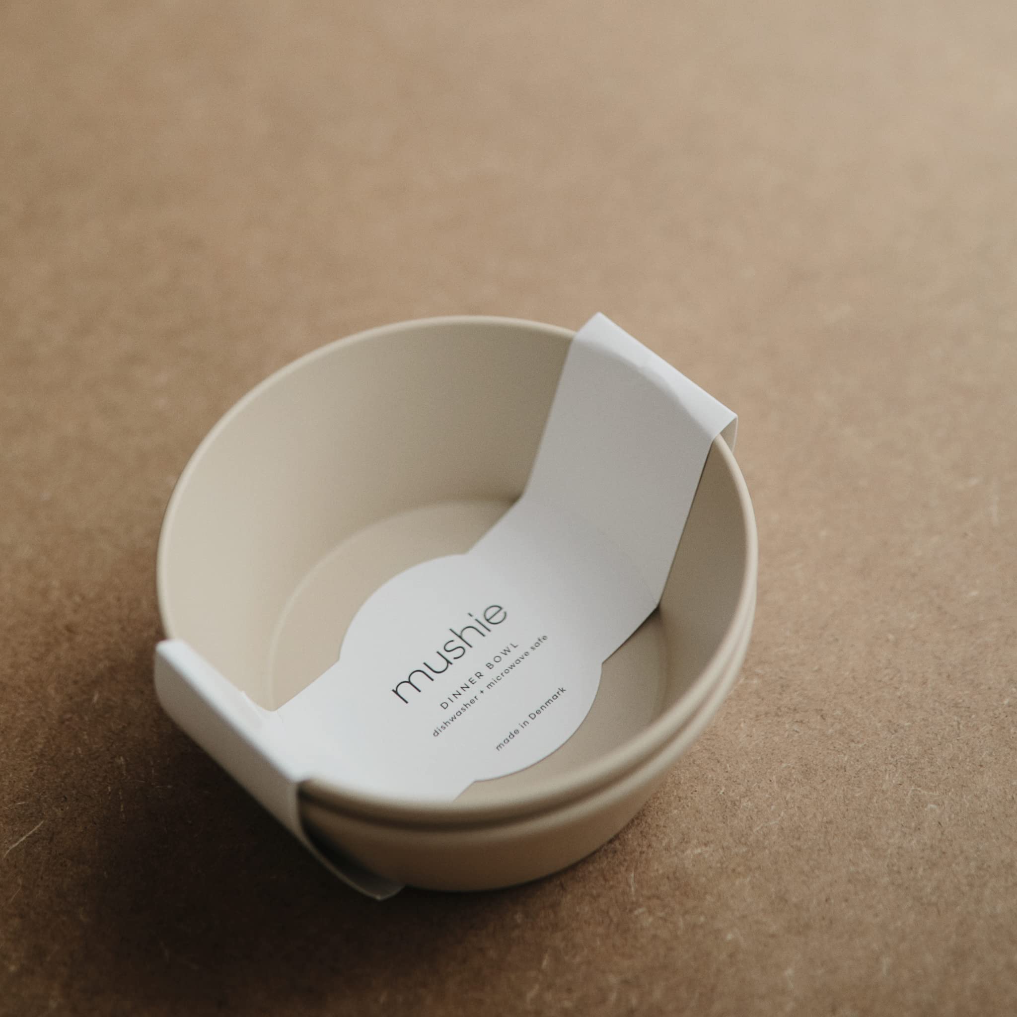 Mushie Danish-made bowls vanilla close-up, showcasing a smooth, durable surface.