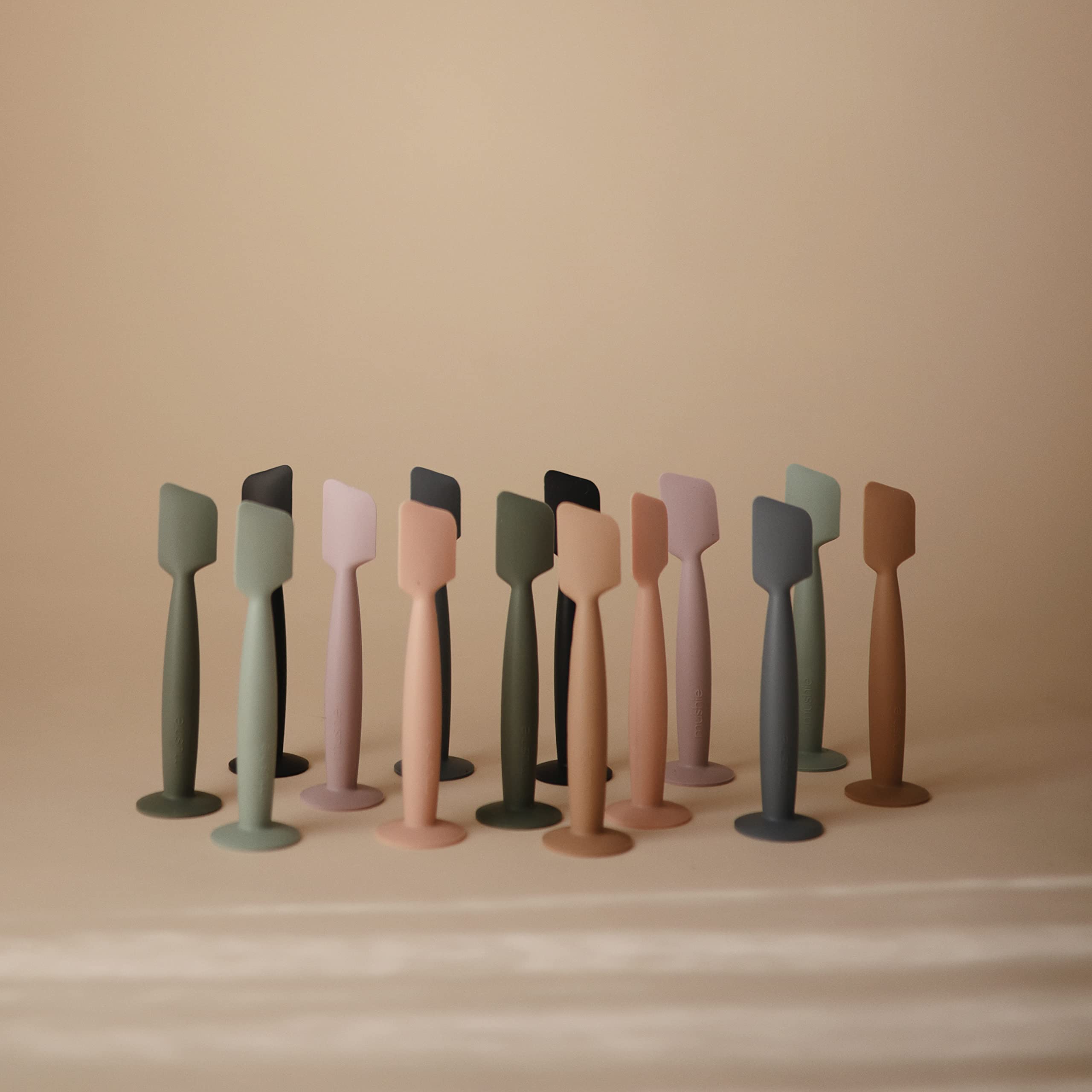 Mushie Diaper Cream Applicator demonstrates a smooth sweeping motion