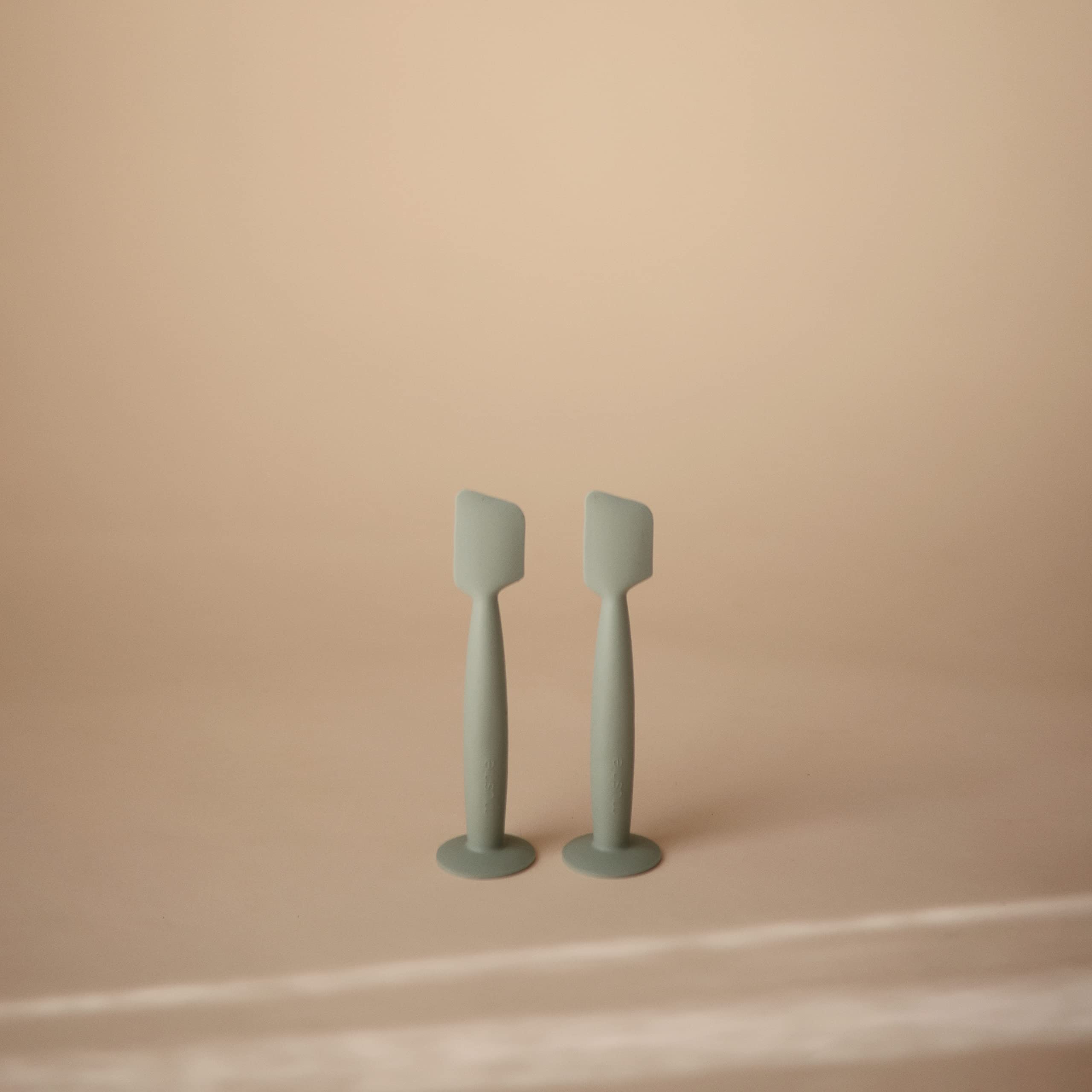 Close-up of Mushie applicator head showing soft silicone texture