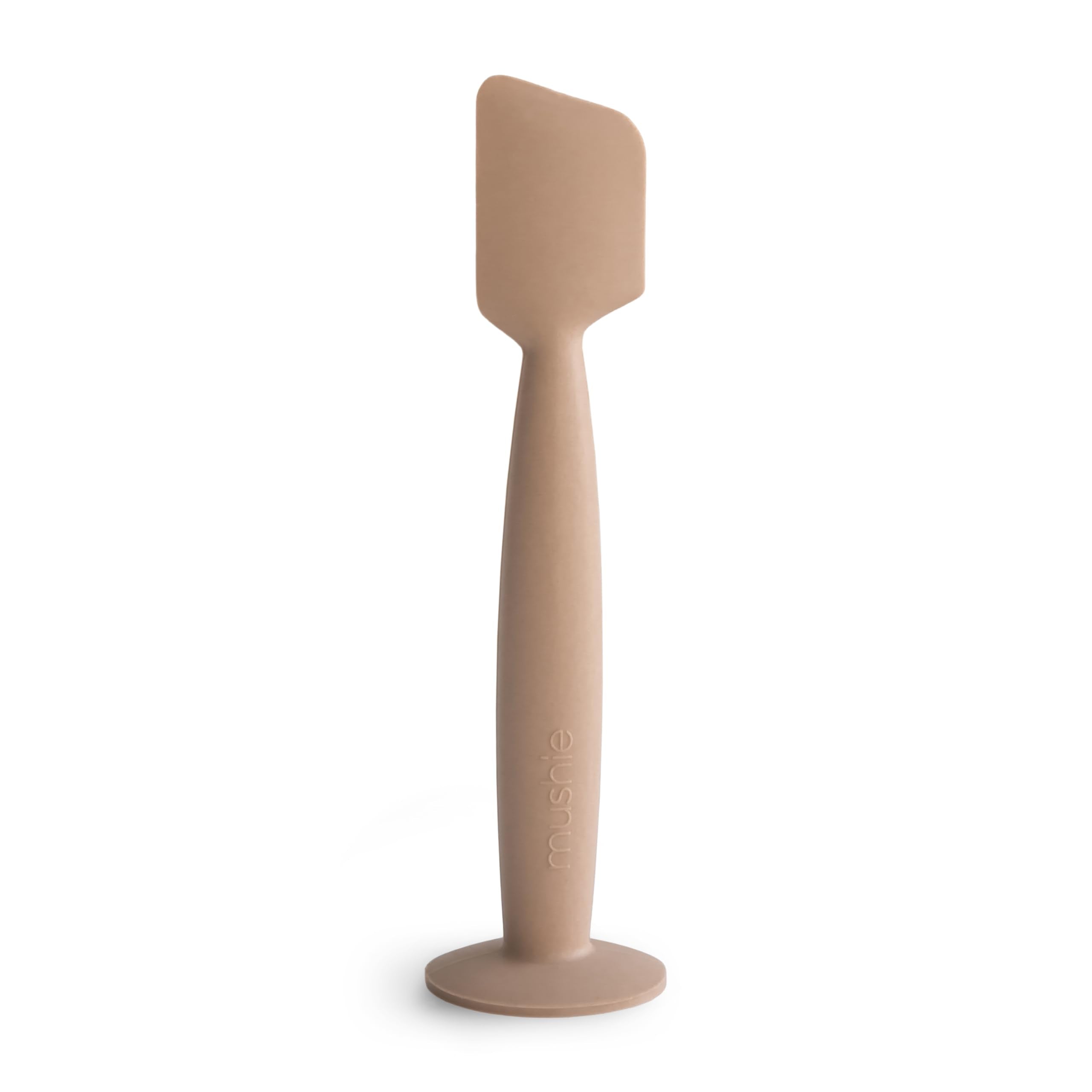 Mushie diaper cream applicator in soft silicone, close-up for mess-free application.
