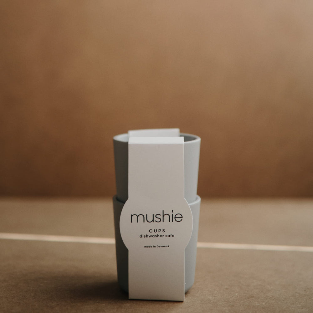 Mushie Sage cups front view highlights soft color and clean Danish styling.
