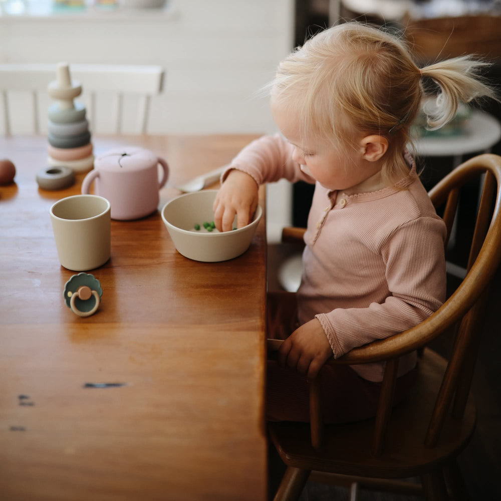 Mushie dinnerware cups stacked to highlight space-saving design