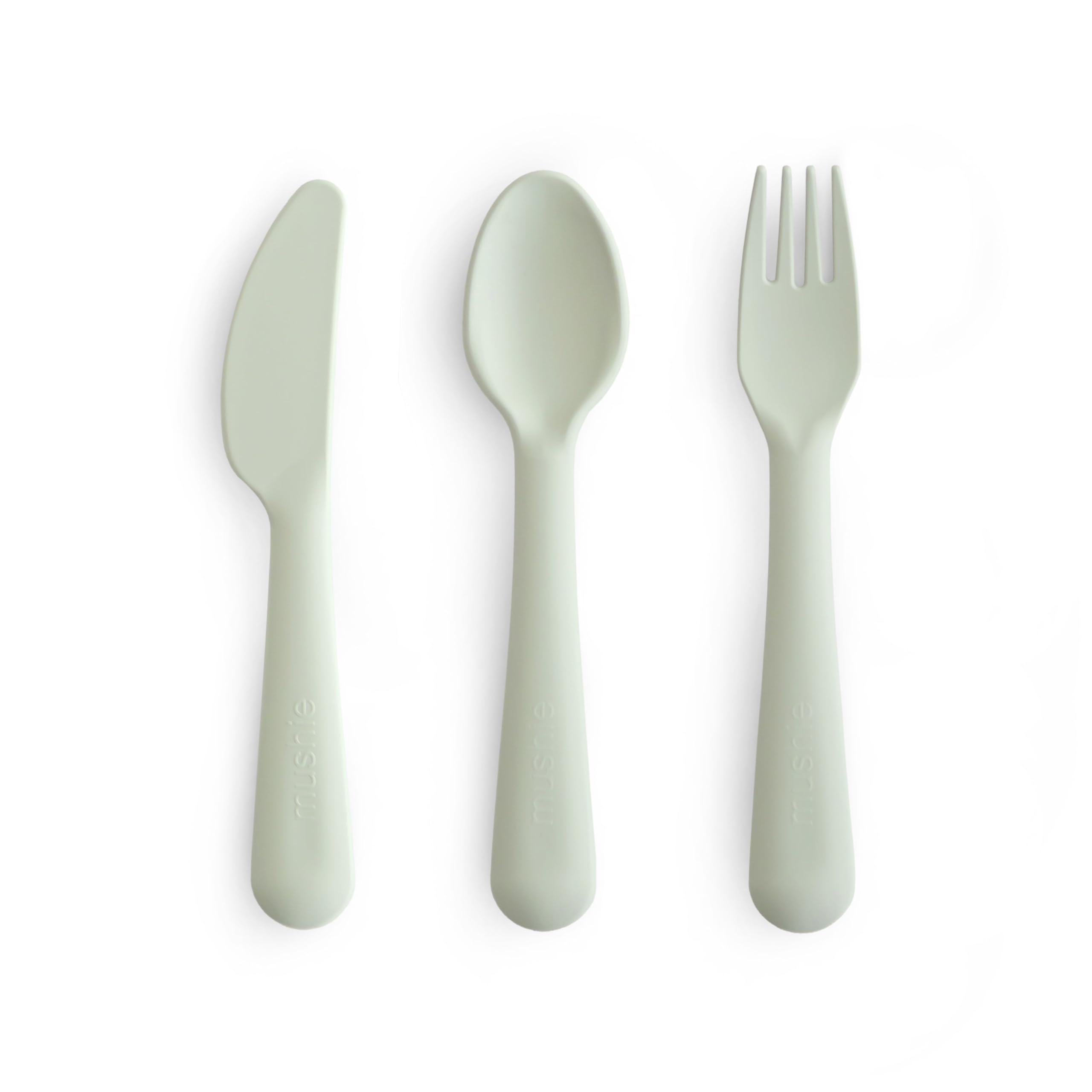 Mushie dinnerware cutlery set sage fork in hand supports easy self-feeding.