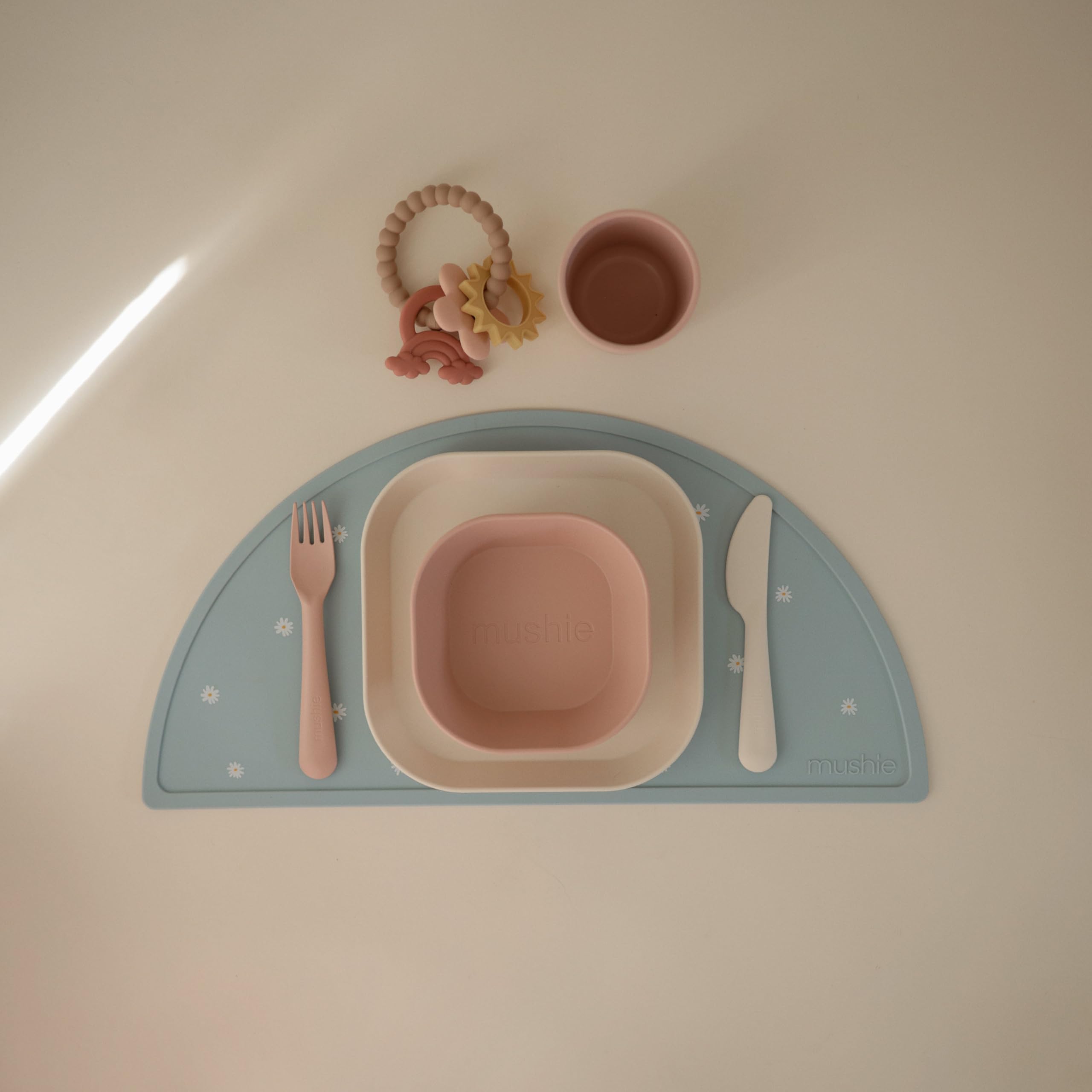 Mushie sage packaging image hints at thoughtful Danish design and safety.