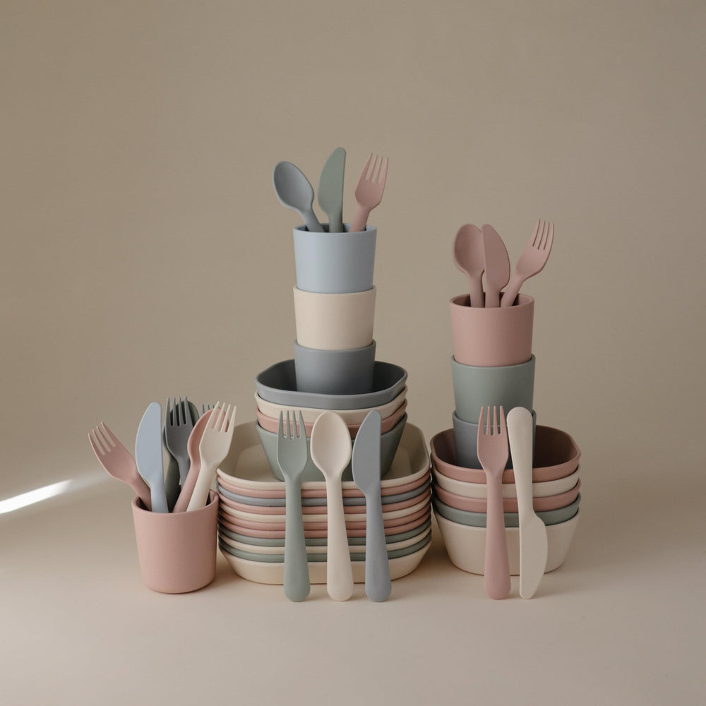 Mushie dinnerware cutlery set sage packaging reflects Danish design and safety.