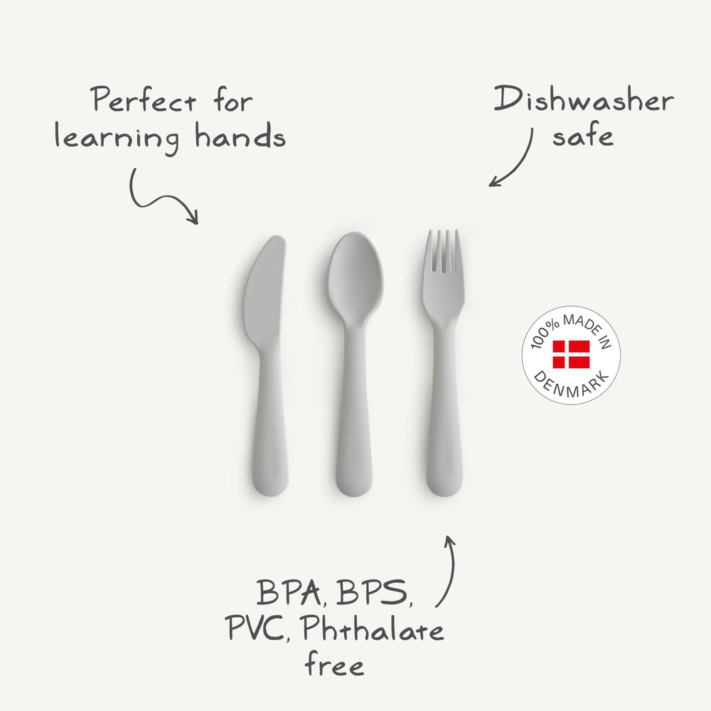 Mushie cutlery set sage spoon close-up highlights comfortable grip for toddler meals.