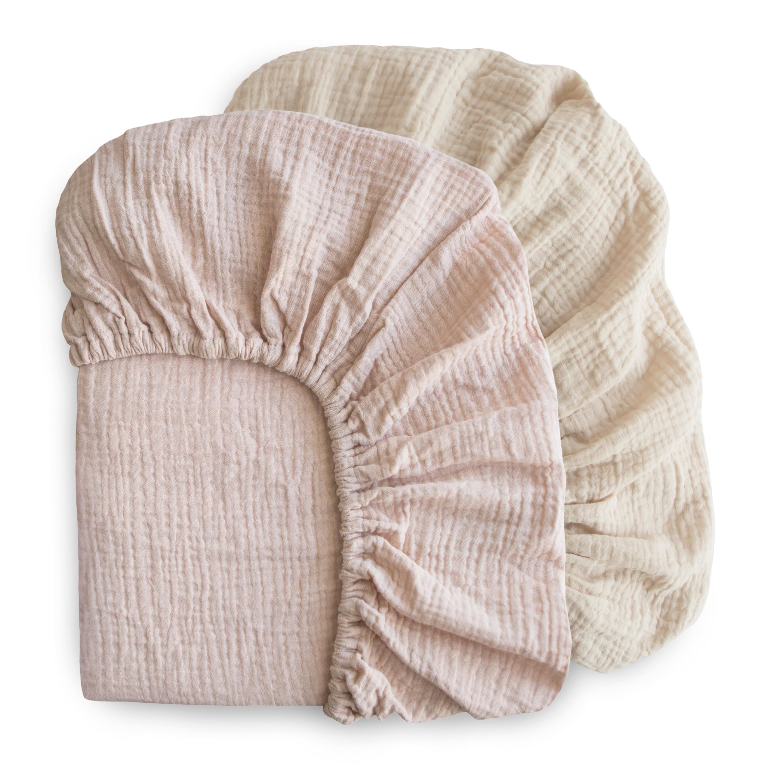 Mushie elastic fitted crib sheet with deep pockets for snug fit.