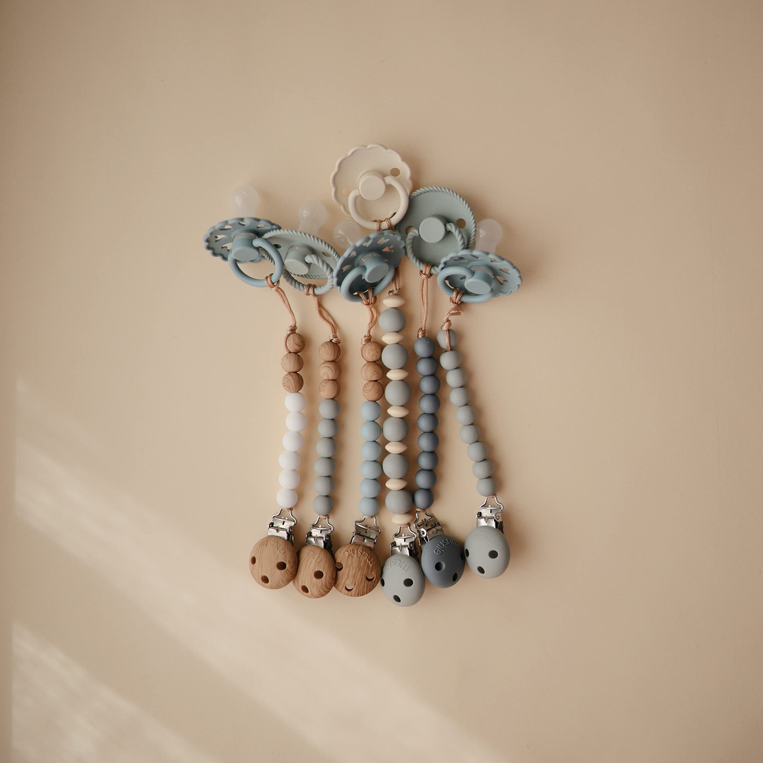 Mushie Eva silicone clip promotes calm moments during on-the-go routines