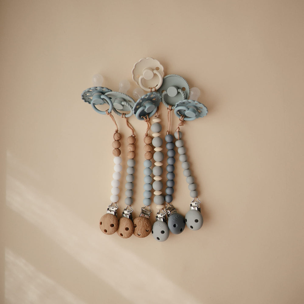 Mushie Eva silicone clip promotes calm moments during on-the-go routines