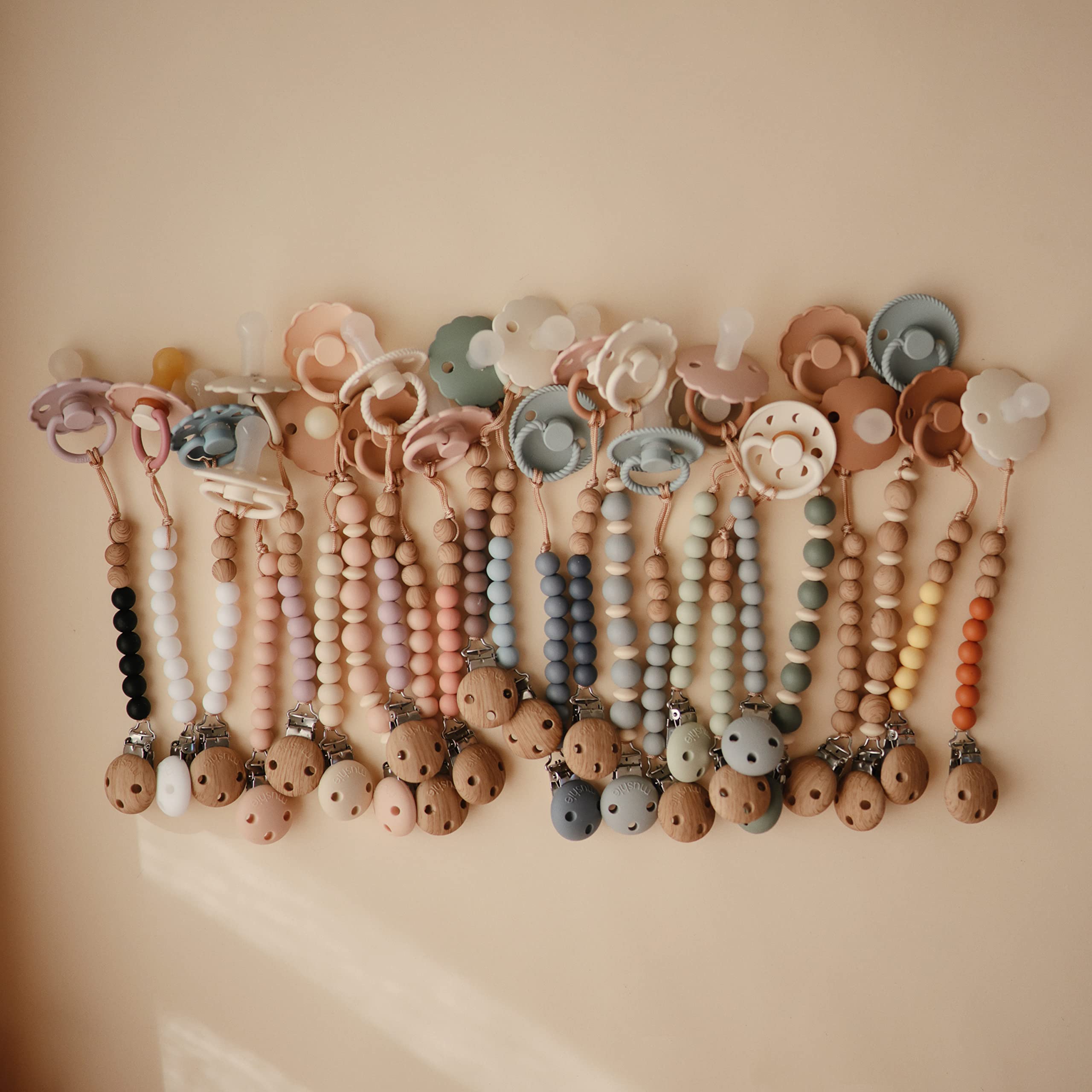 Mushie Eva pacifier clip helps parents keep items in reach while shopping