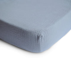 Mushie fitted crib sheet on a mattress shows a snug, secure sleep space.