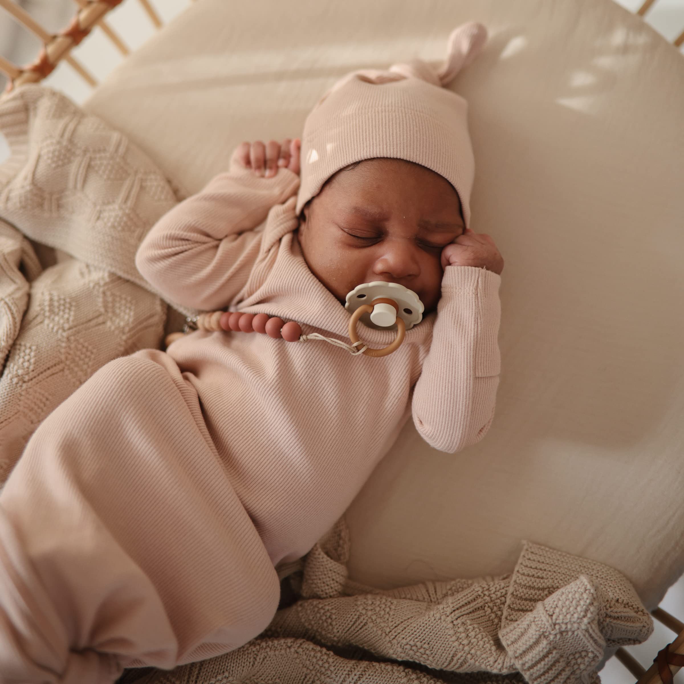 Mushie muslin crib sheet fog closeup fabric highlights gentle softness.