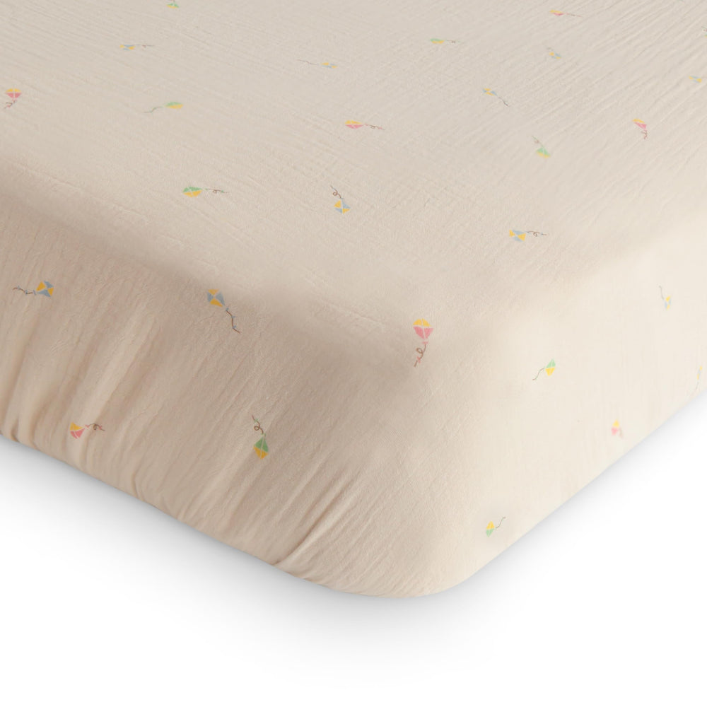 Mushie extra-soft muslin crib sheet in use shows breathable comfort