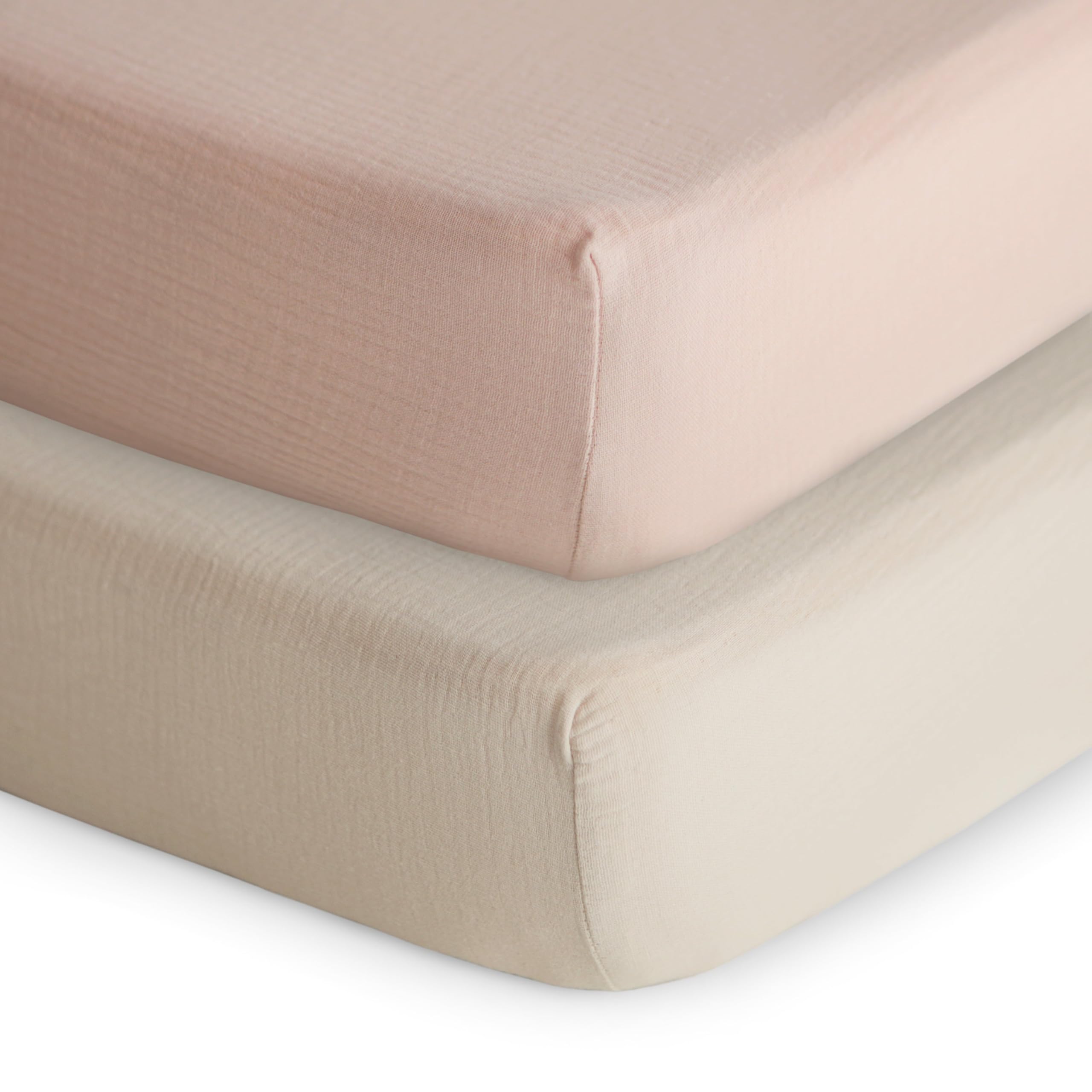Mushie extra-soft muslin fitted crib sheet two-pack in blush and fog.
