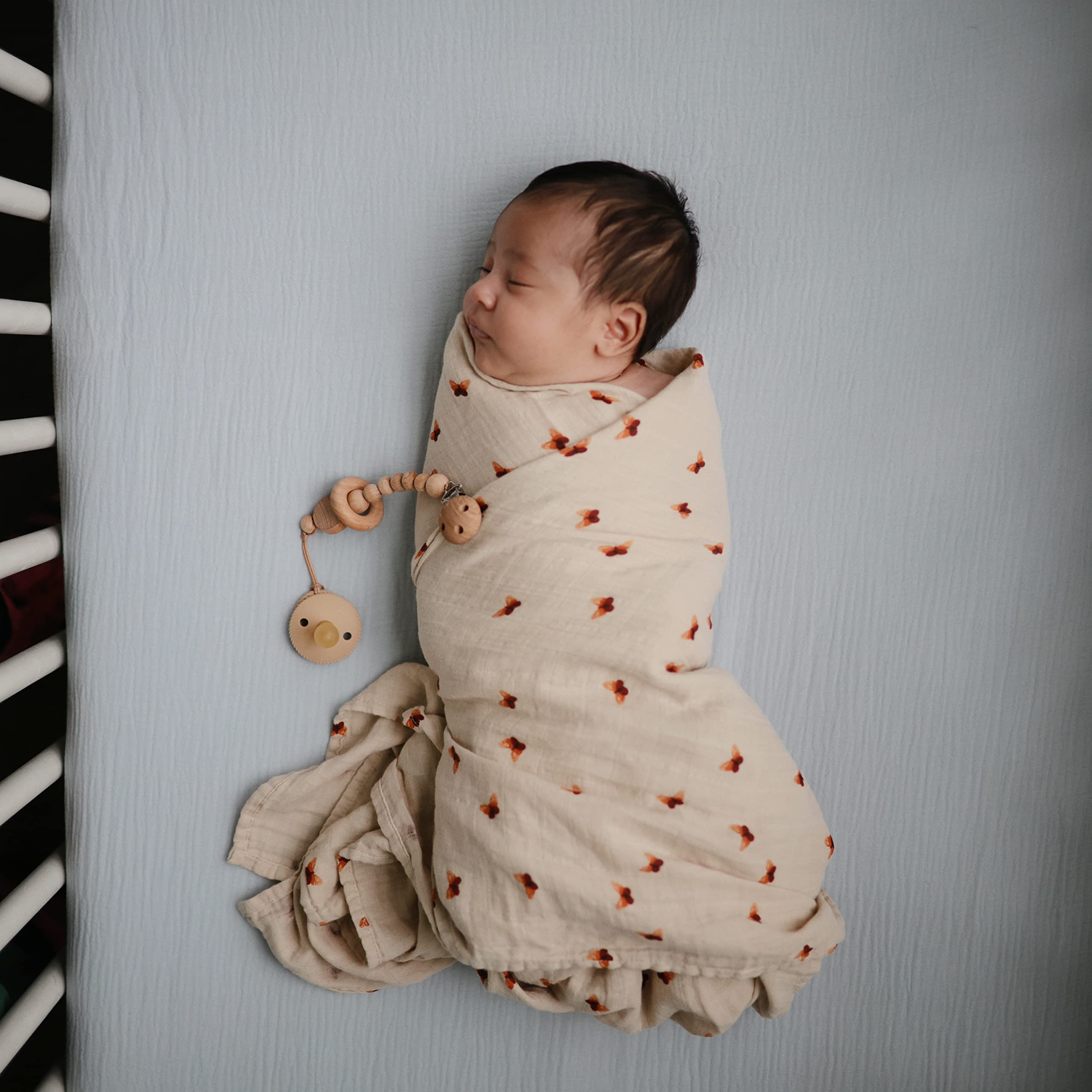 Mushie baby-blue muslin crib sheet prewashed for softness against skin.