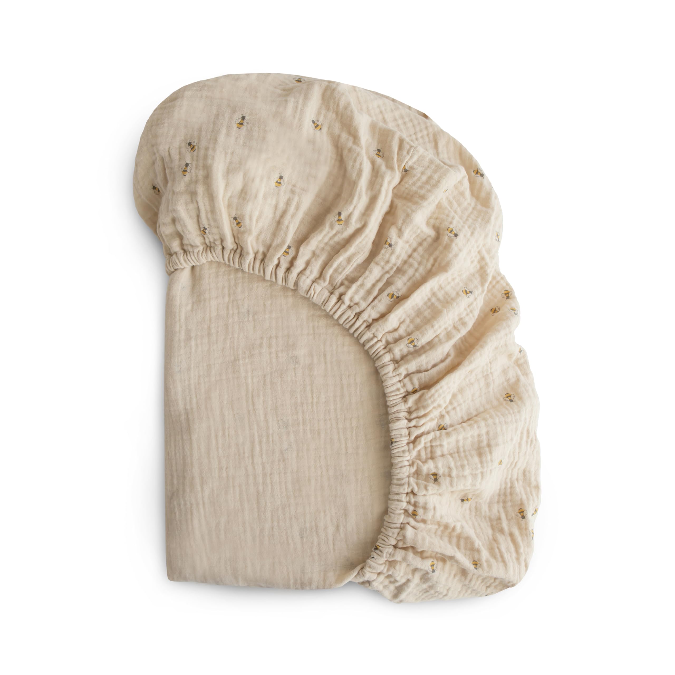 Mushie extra-soft muslin fitted crib sheet with bees pattern offers breathable warmth.