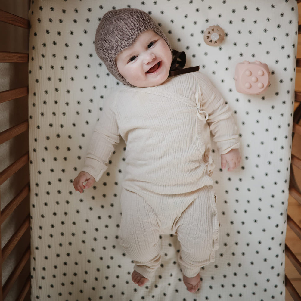 Mushie fabric closeup reveals ultra-soft muslin texture.
