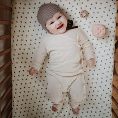 Mushie fabric closeup reveals ultra-soft muslin texture.