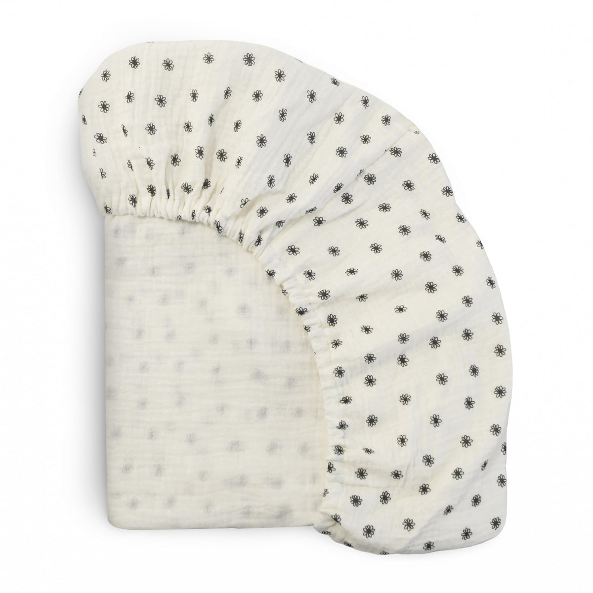 Mushie Extra-Soft Muslin Fitted Crib Sheet flatlay shows breathable cotton softness.