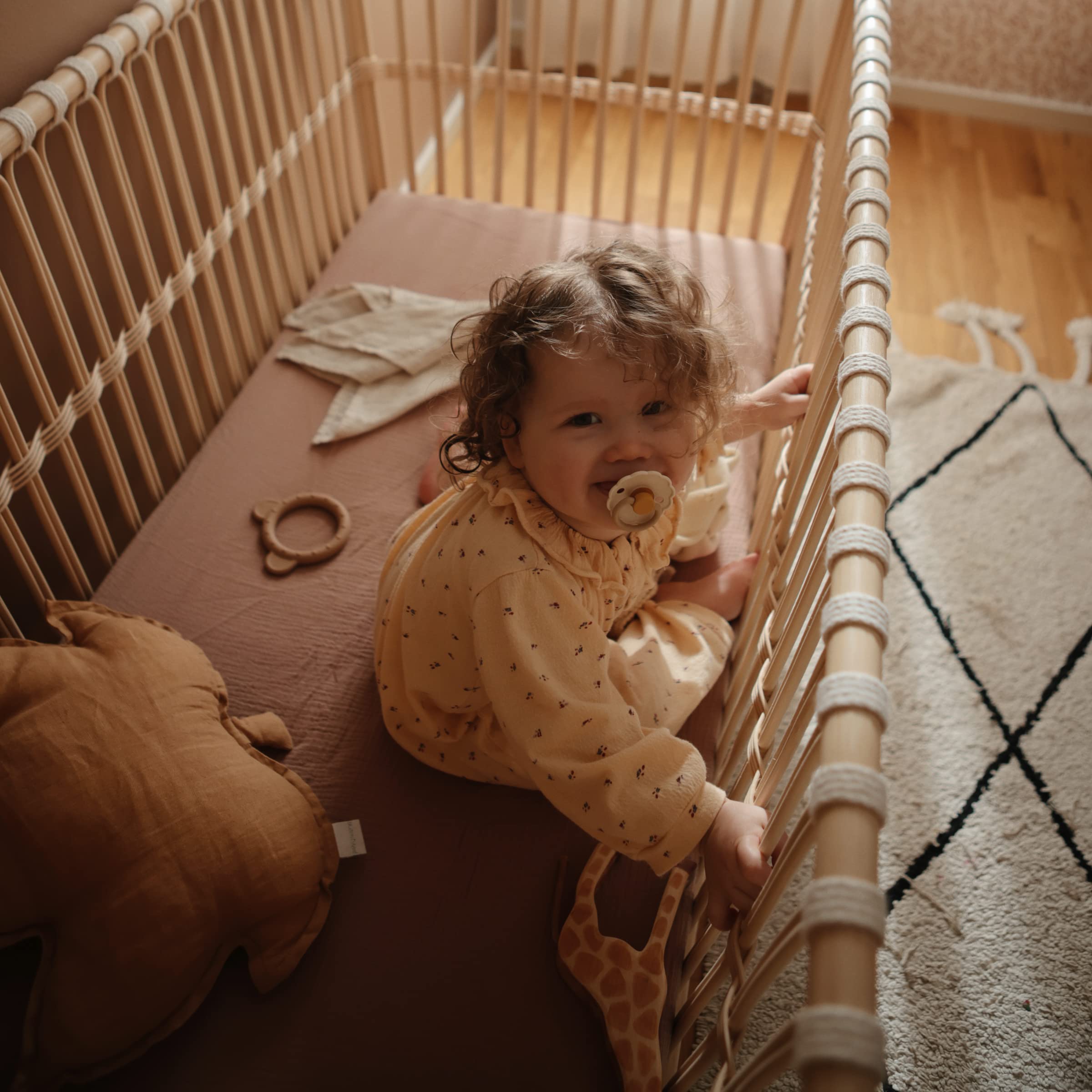 Mushie deep pockets keep the sheet securely in place during baby’s sleep.