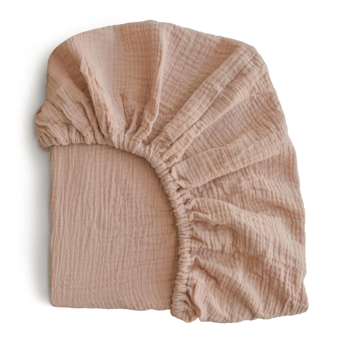Mushie extra soft muslin fitted crib sheet texture shows breathable cotton for gentle baby comfort.