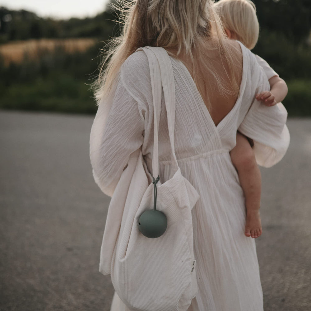 Mushie silicone BPA free case keeps pacifiers safe and clean