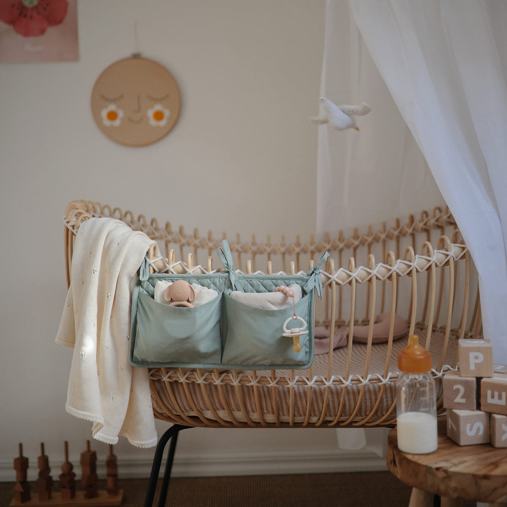 Mushie Hera clip on-the-go accessory pairs with baby outfits for tidy travel