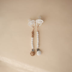 Mushie Hera pacifier clip 8-inch length highlighted for easy attachment and reach.