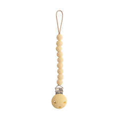 Mushie Hera pacifier clip 8inch closeup, durable silicone for on-the-go use.