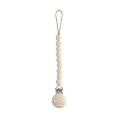 Mushie Hera pacifier clip shifting sand closeup shows safe silicone beads for soothing on the go.