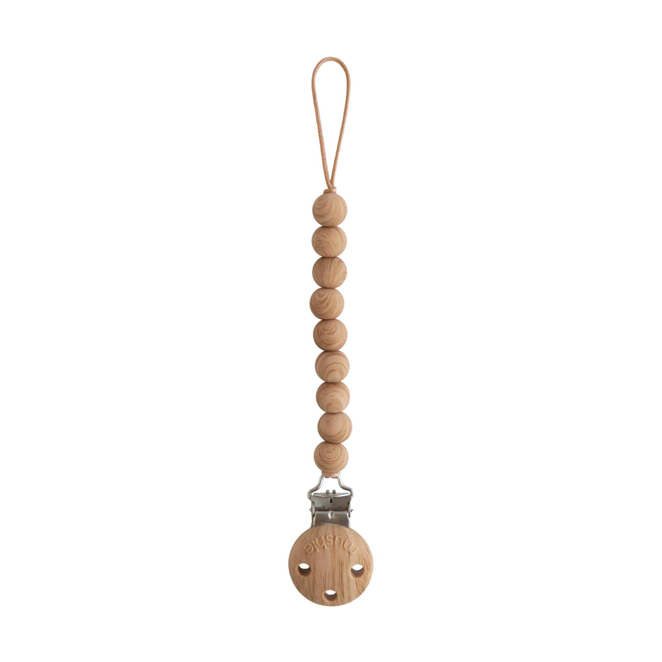 Mushie Hera pacifier clip with soft-color silicone beads for on-the-go use.