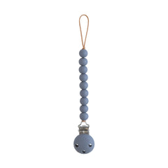 Mushie Hera pacifier clip features a silicone clip for secure on-the-go attachment