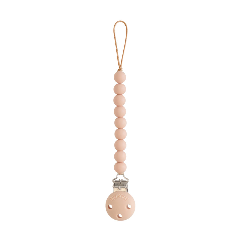 Mushie Hera pacifier clip with soft pink beads for secure on the go use.