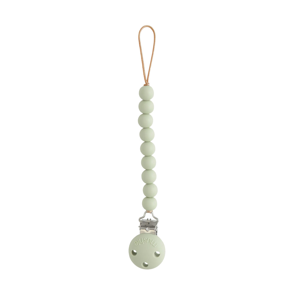 Mushie Hera Sage pacifier clip closeup shows silicone beads and screw-free clasp.