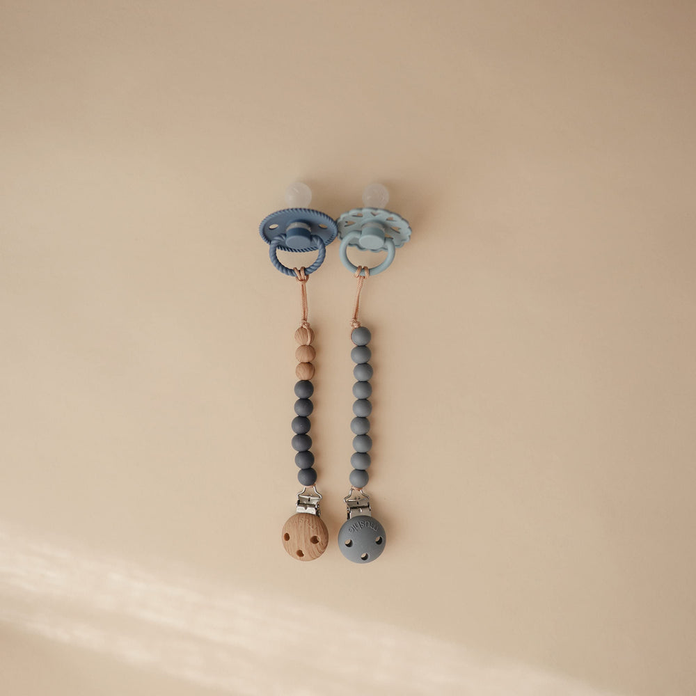 Mushie Hera silicone beads in soft colors for tactile soothing during daily routines