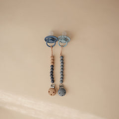 Mushie Hera silicone beads in soft colors for tactile soothing during daily routines