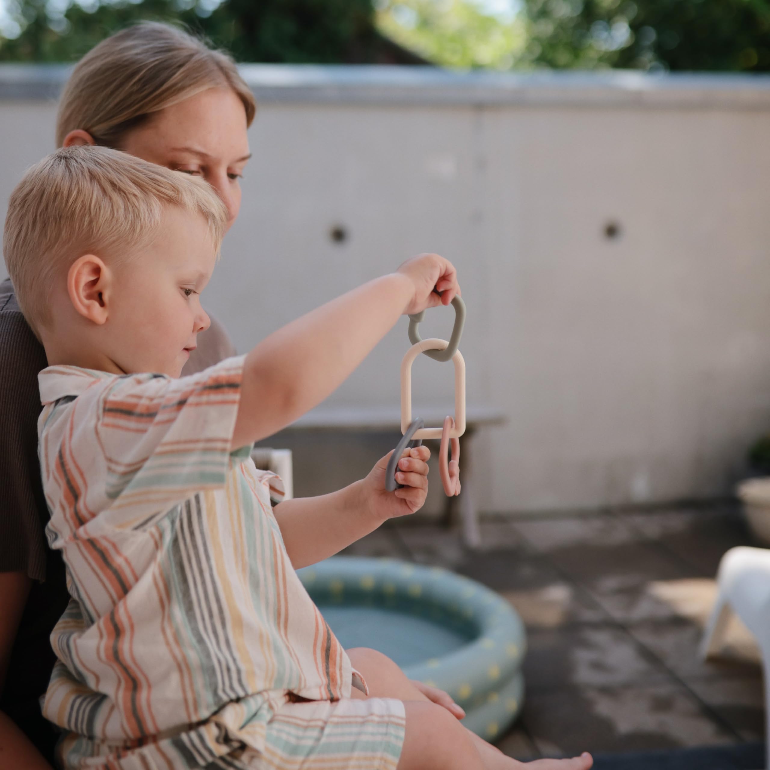 Mushie Key Toy easy cleaning with warm soapy water.