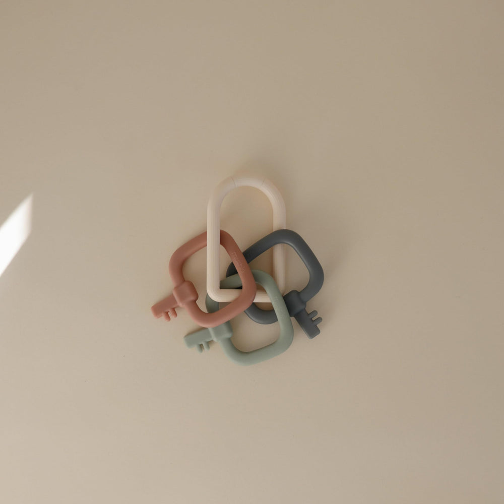 Mushie Key Toy lightweight ring fits tiny hands for easy grasp.