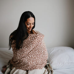 Mushie leopard shopping-cart cover keeps baby comfy.