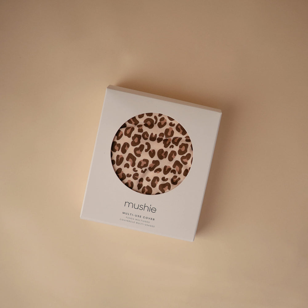 Mushie leopard stroller cover stretches to fit and protect.