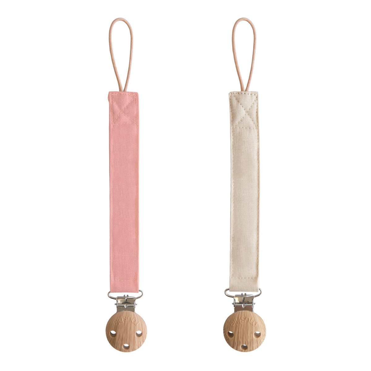 Mushie linen pacifier clip Dusty Rose closeup with secure faux wood clasp for on-the-go use.