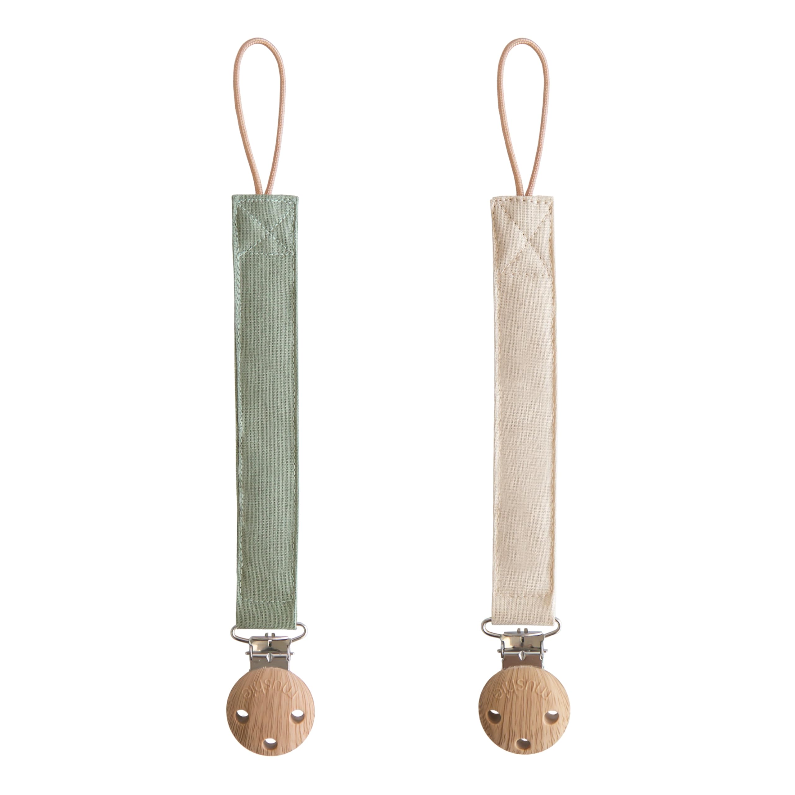 Mushie linen pacifier clip olive closeup with soft fabric for on-the-go comfort
