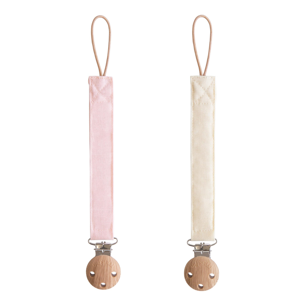 Mushie linen pacifier clip with soft fabric strap keeps pacifier within baby's reach