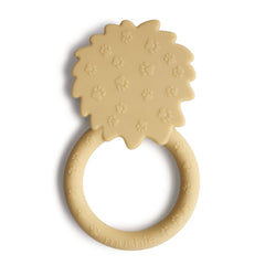 Mushie Lion teether texture closeup; tactile surfaces aid sensory exploration