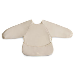 Mushie Long Sleeve Bib Pastel Blooms close-up fabric showing soft, water-resistant surface.